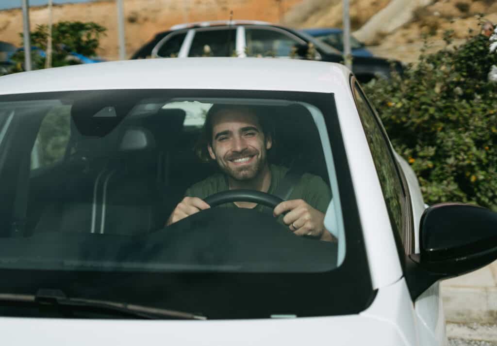 Caleb getting ready to drive our car rental in Naxos off the lot - he is excited to go driving in Naxos