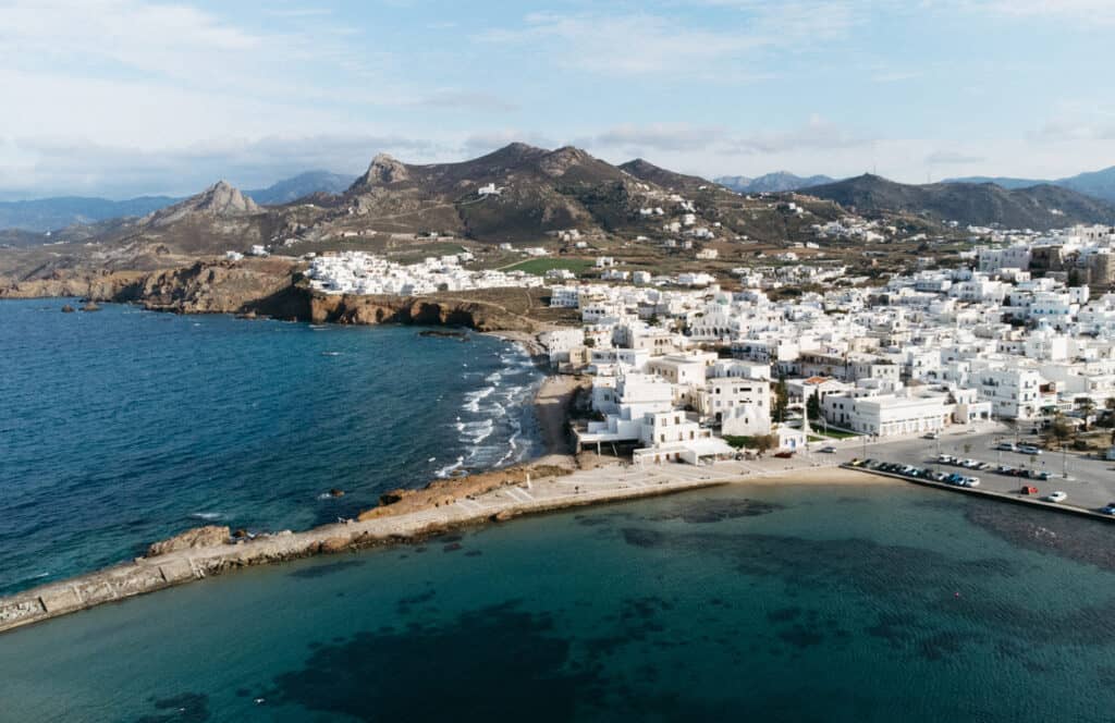 a drone shot of Naxos Port, which looks very different from Paros Port when comparing Naxos vs Paros
