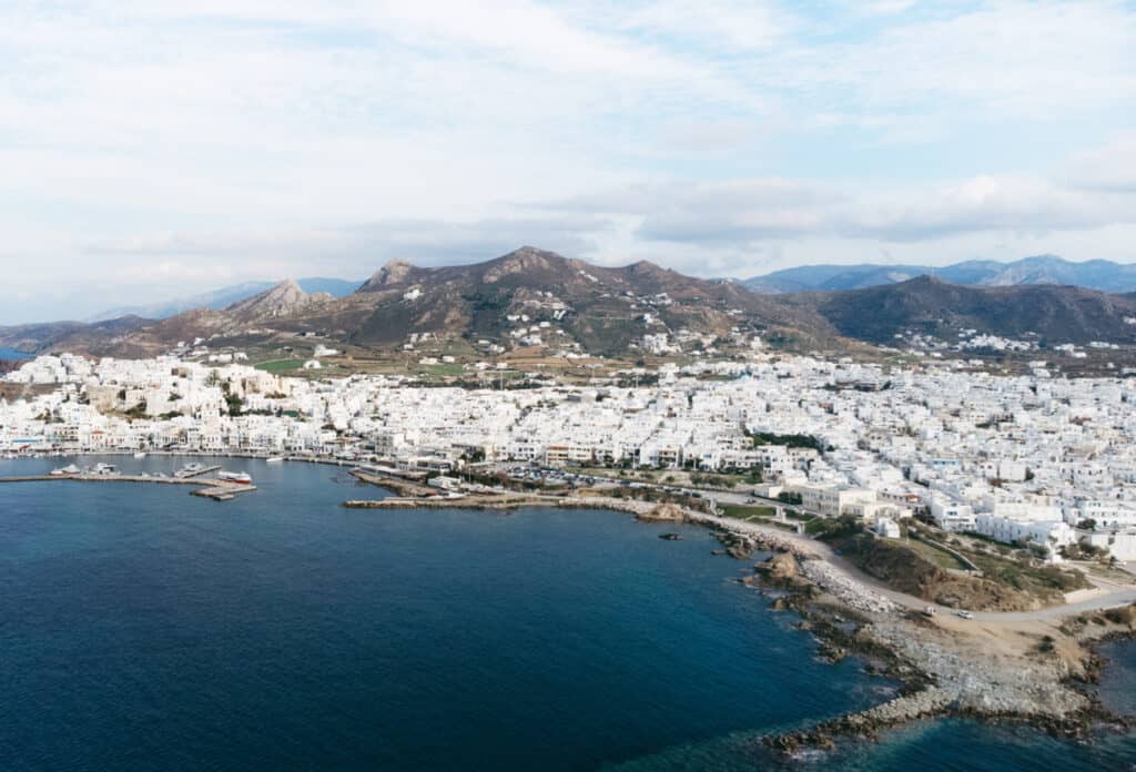 drone view of Naxos Town. Chora is a great place to stay in Naxos because it is close to the port.