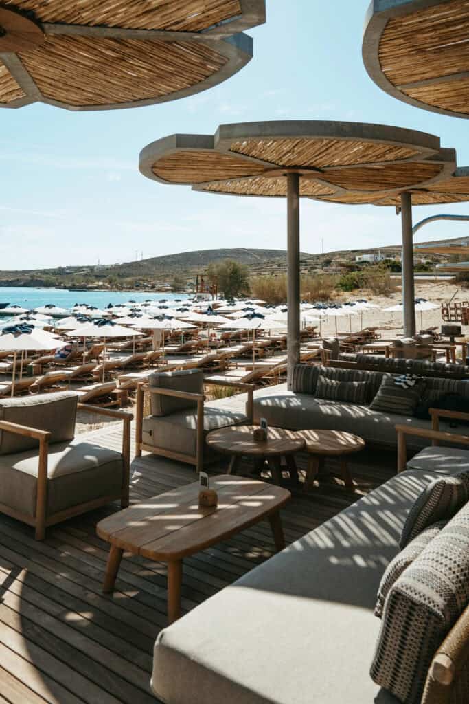 Shaded lounge seating with a view over sunbeds and umbrellas at Marcello Beach Paros