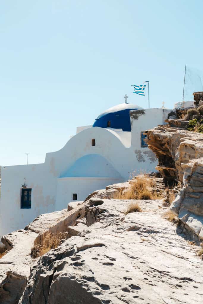 Monastery of St. John's of Deti perched on a rocky hillside near Monastiri Beach, Paros