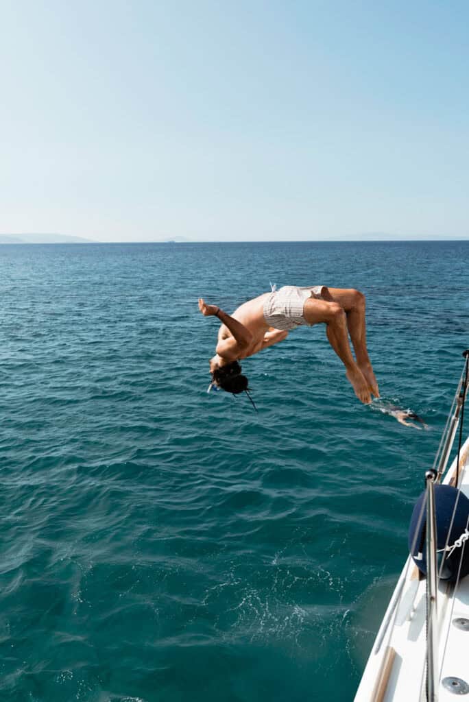 Caleb doing a backflip off a the Santa Marina catamaran into the Aegean Sea