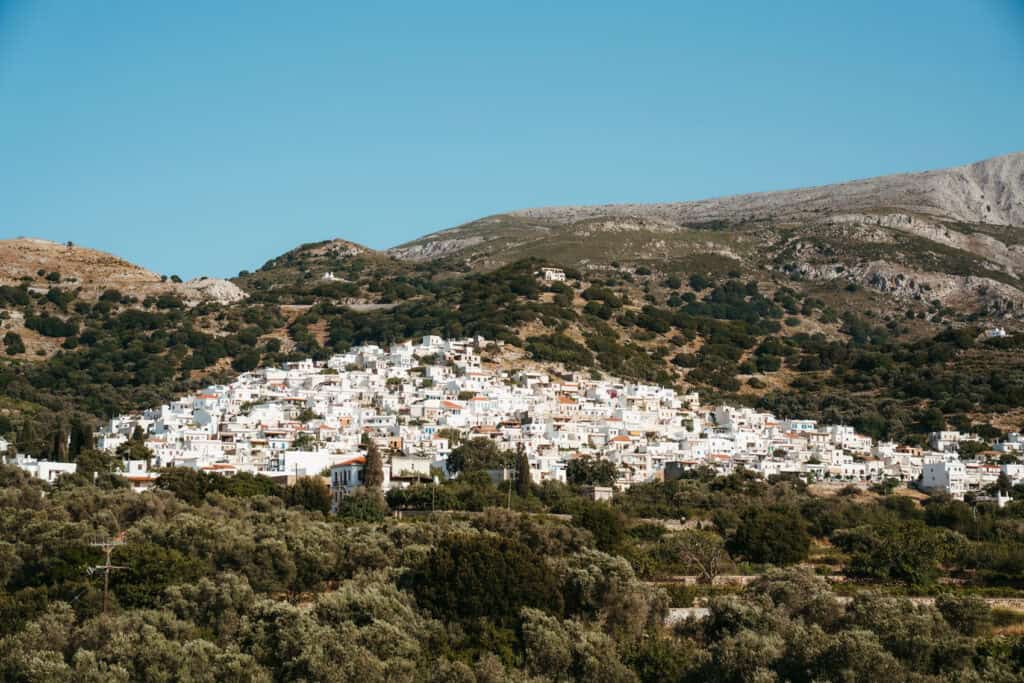 Beautiful view of a traditional Naxos village with white houses and narrow streets.